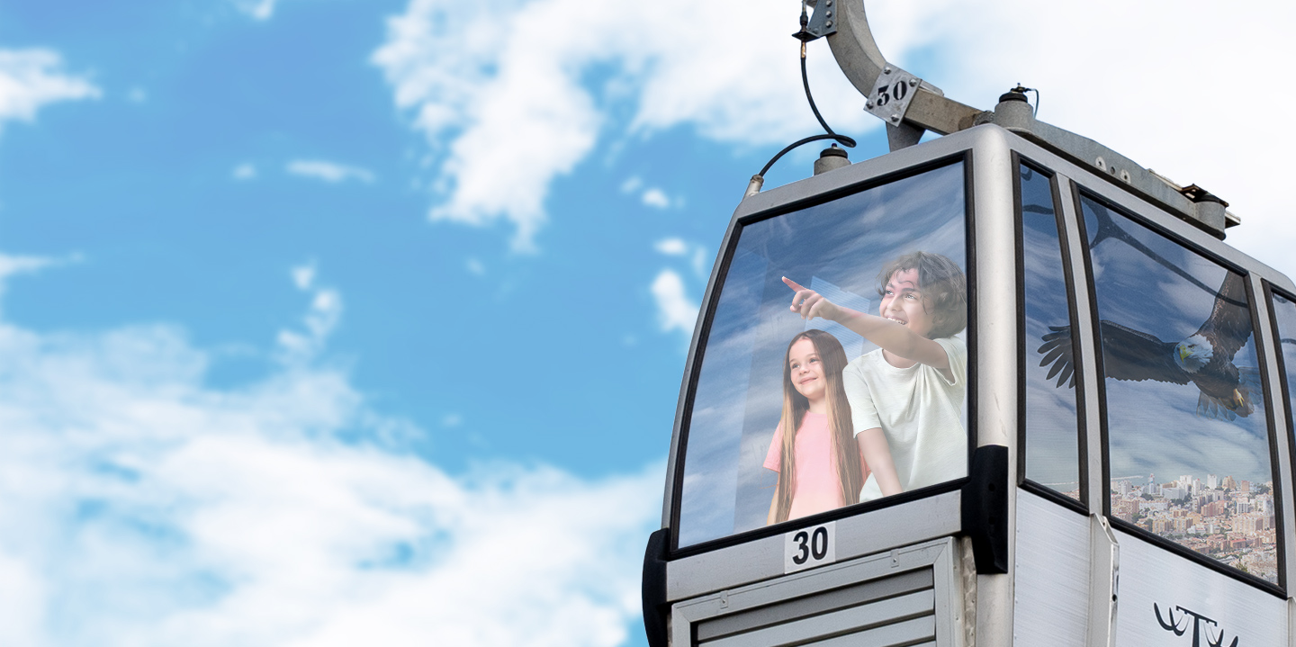 Children going up in the gondola lift of the Benalmádena Cablecar.